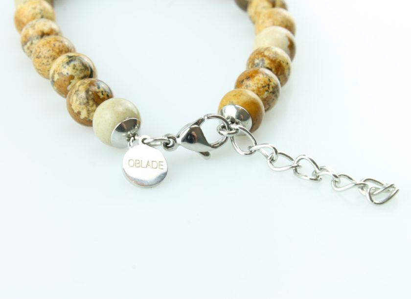 Bracelet pour homme composé de perles de jaspe scénique et de pierres rutile naturelles.