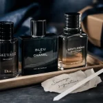 Meilleurs parfum hommes : 3 flacons de parfum sur plateau bois